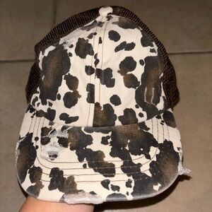 C.C Women's Distressed Cow Print Hat with Pony tail opening in back